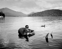 James in Inner Tube with Duck, Lake Placid, New York, 2006
